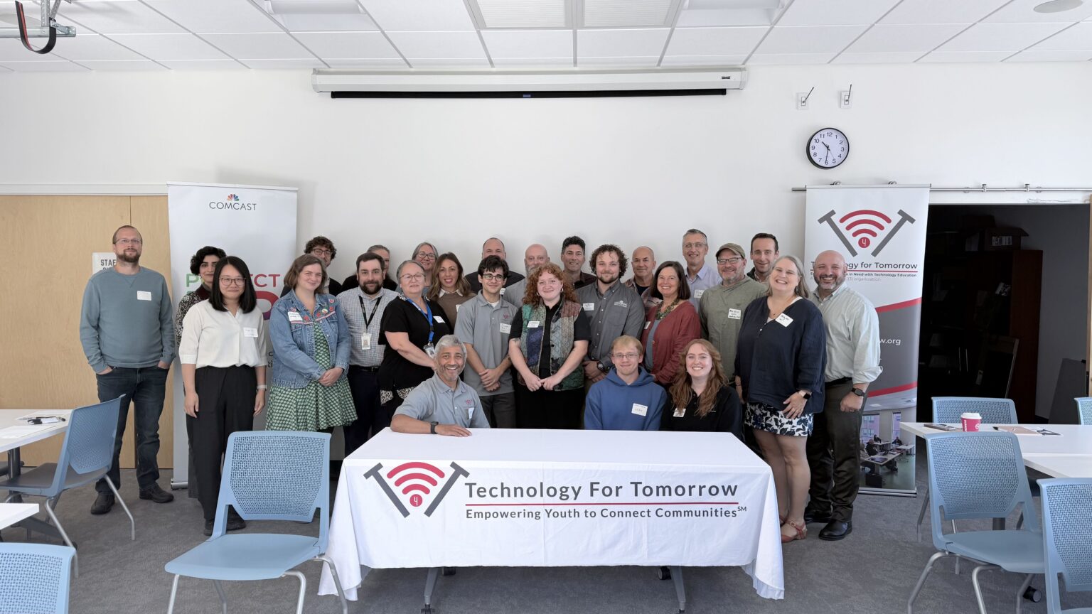 Representatives from Vermont Nonprofit organizations take a large group photo in celebration of the 2026 Digital Equity and Access Roundtable event hosted at the South Burlington Public Library by Technology for Tomorrow